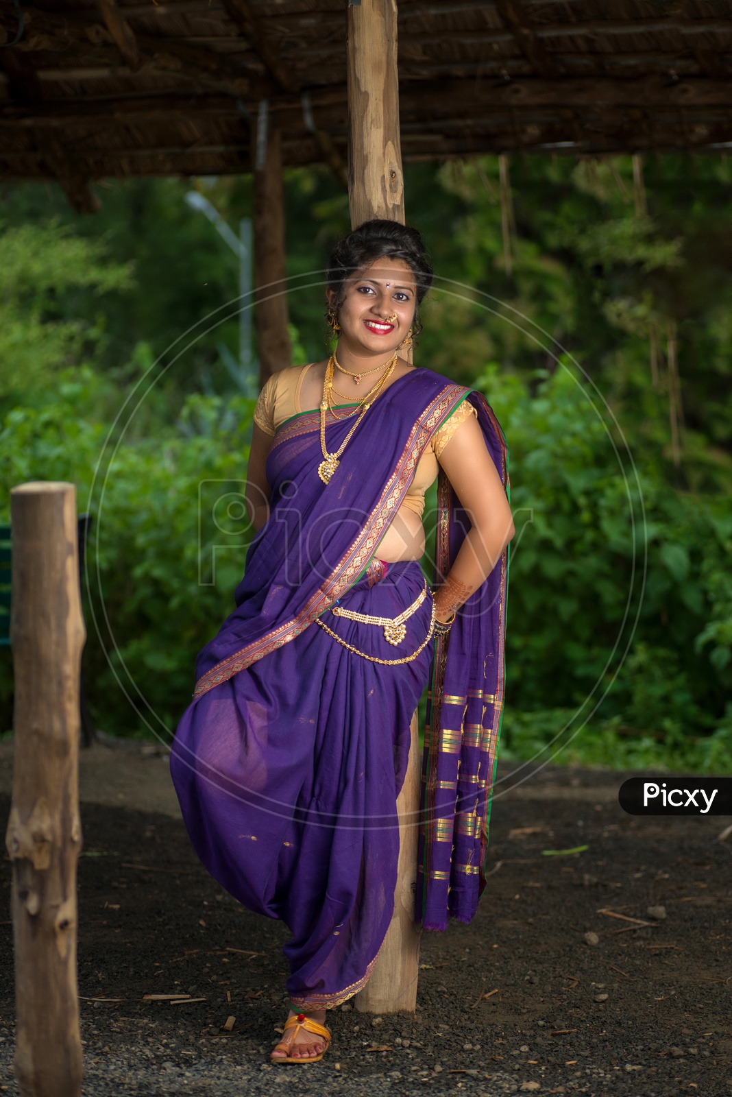 Free Photo | Young woman posing while wearing traditional sari garment