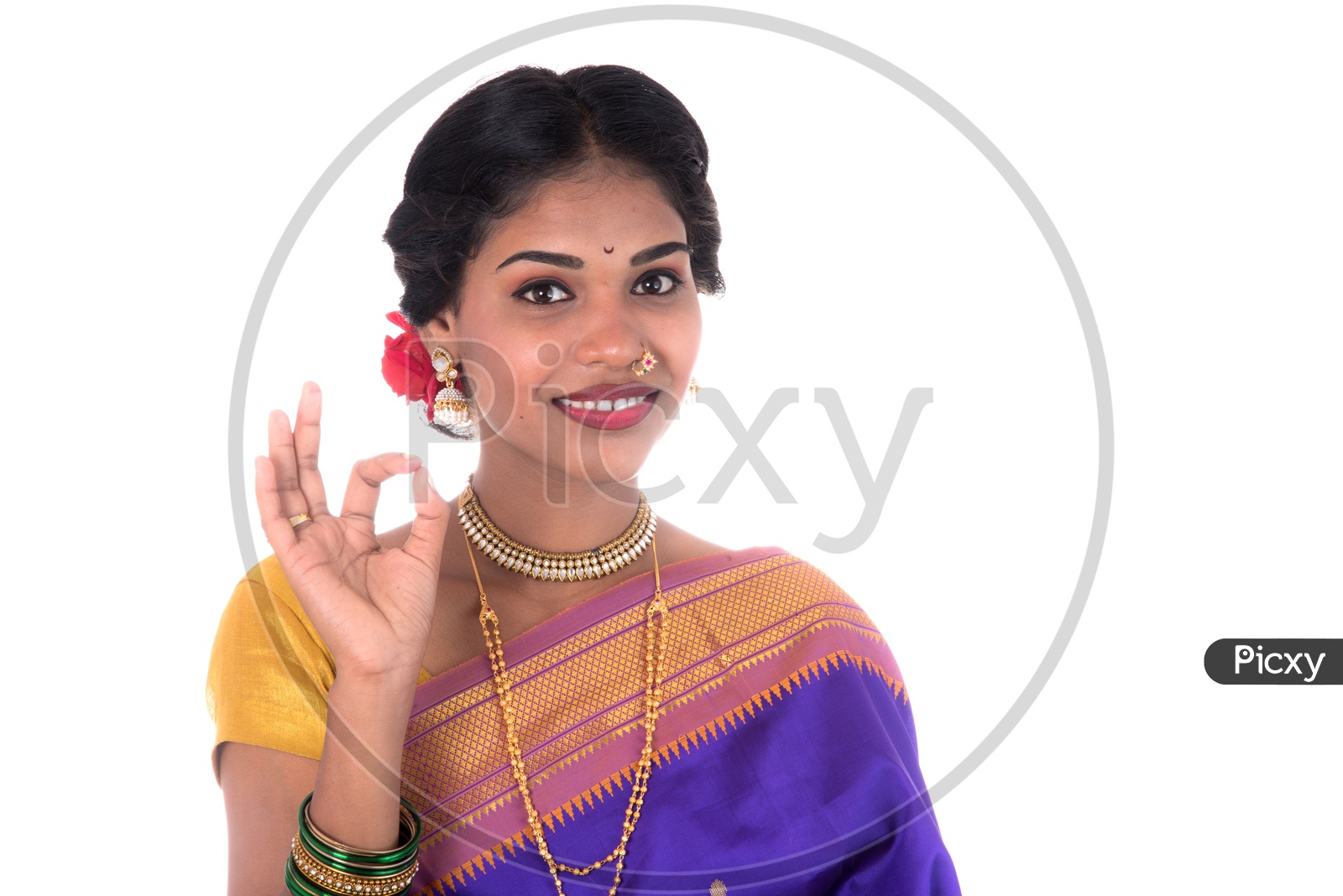 A Young Indian Traditional Girl Wearing an Sari And With an Expression Posing On an isolated White Background