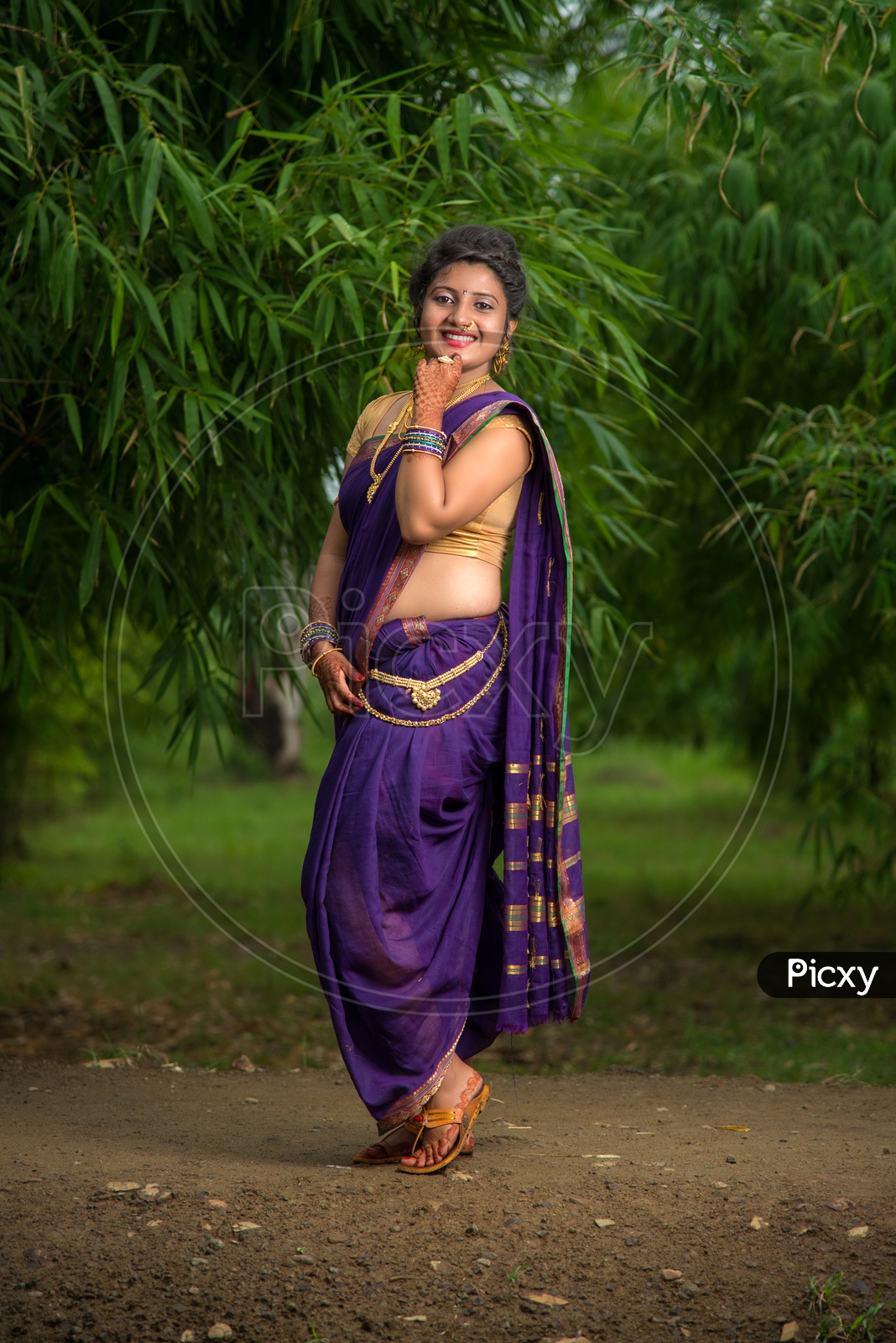 Portrait of a beautiful Indian girl in a greeting pose to Namaste hands.  India woman in traditional saree. Stock Photo | Adobe Stock