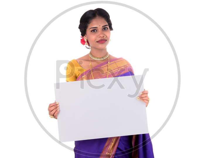 An Indian Traditional Woman Showing an Empty Placard With Space With a Smile Face On an Isolated White Background