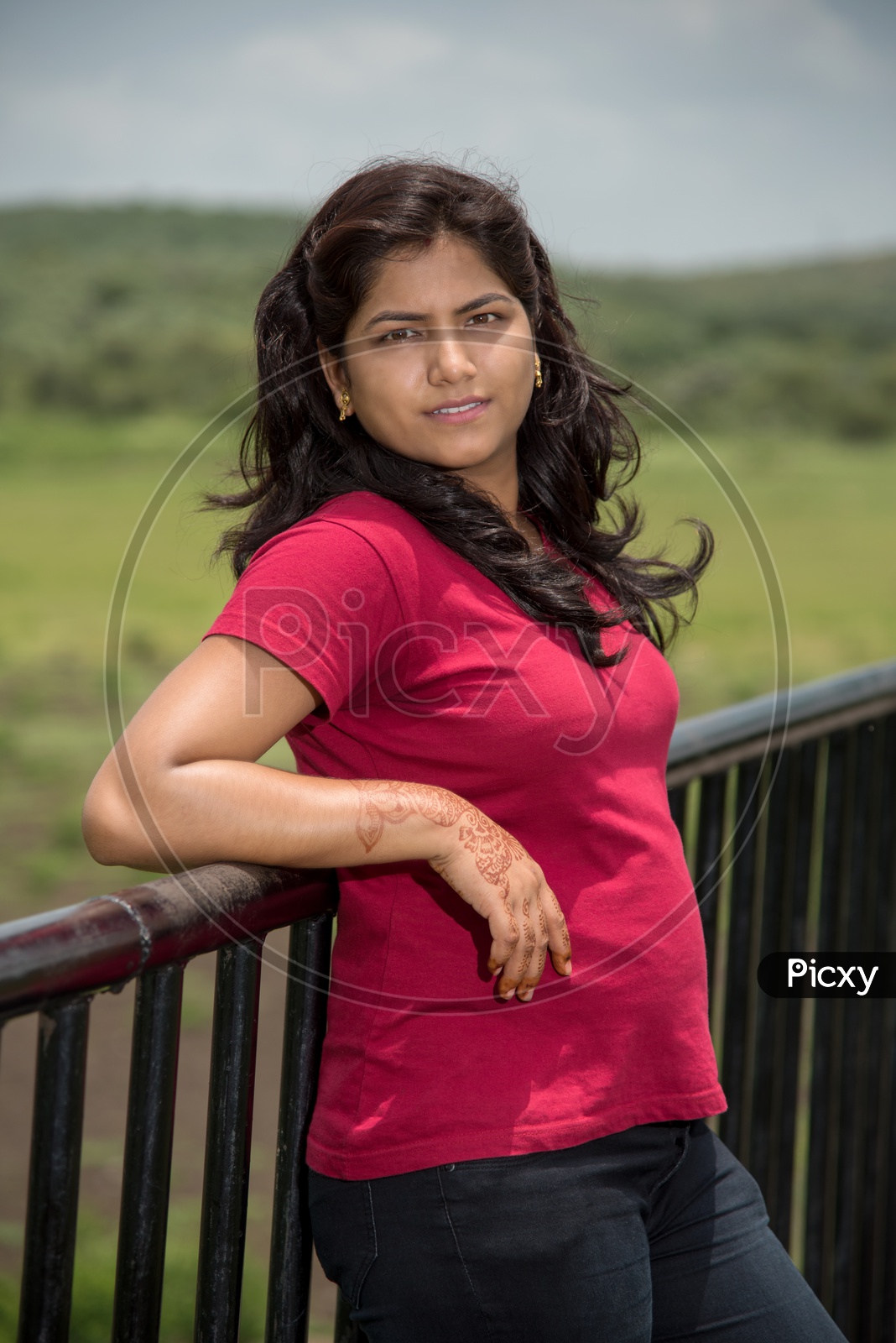 Portrait Of a Young Indian Beautiful Woman Posing In Outdoor Or In a Park Background