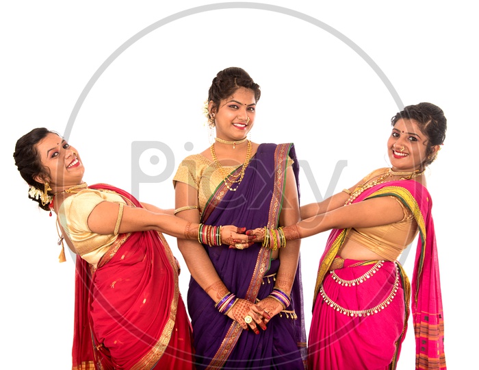 Portrait Of a Young Traditional Marathi Woman or Sisters Wearing an Elegant Sari And Posing With Smile Face And With Expression  On an Isolated White Background