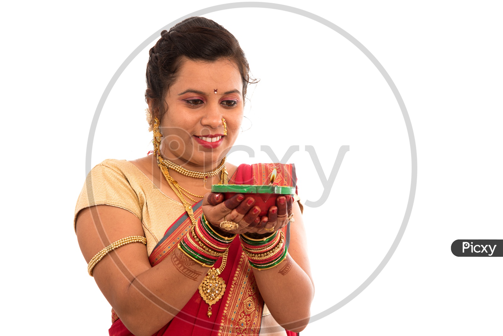 A Traditional Indian Woman  Holding Diwali Diya In Hand  On an Isolated White Background