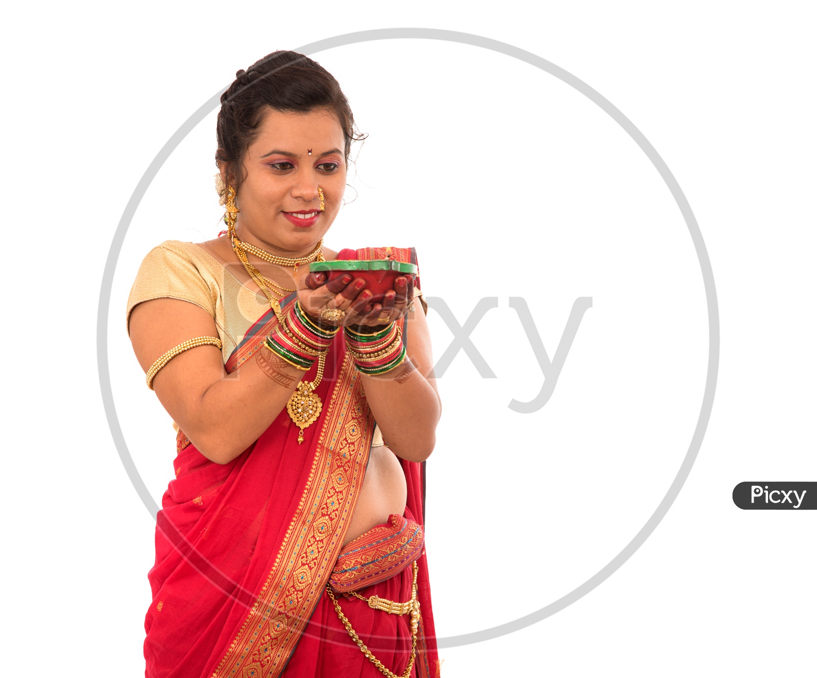 A Traditional Indian Marathi  Woman  Holding Diwali Diya In Hand  On an Isolated White Background