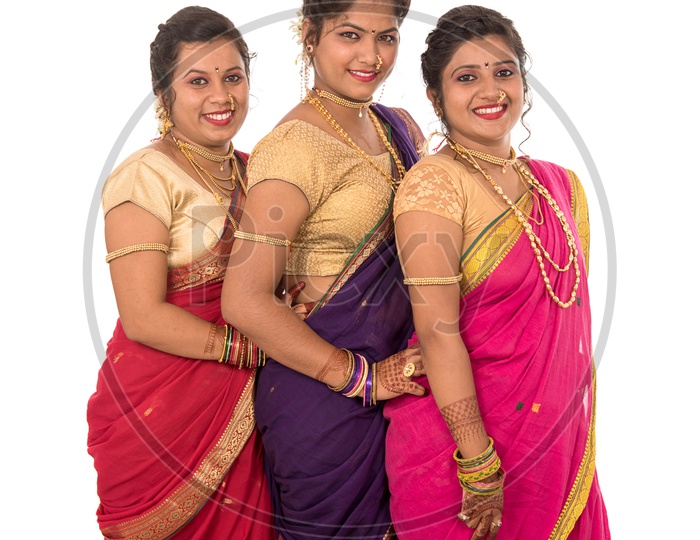 Image of Portrait Of a Young Traditional Marathi Woman or Sisters Wearing  an Elegant Sari And Posing With Smile Face And With Expression On an  Isolated White Background-NJ065488-Picxy