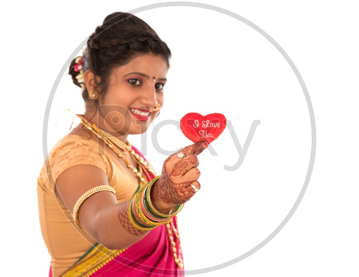 A Traditional Marathi Woman Showing I Love You Placard On an Isolated White Background