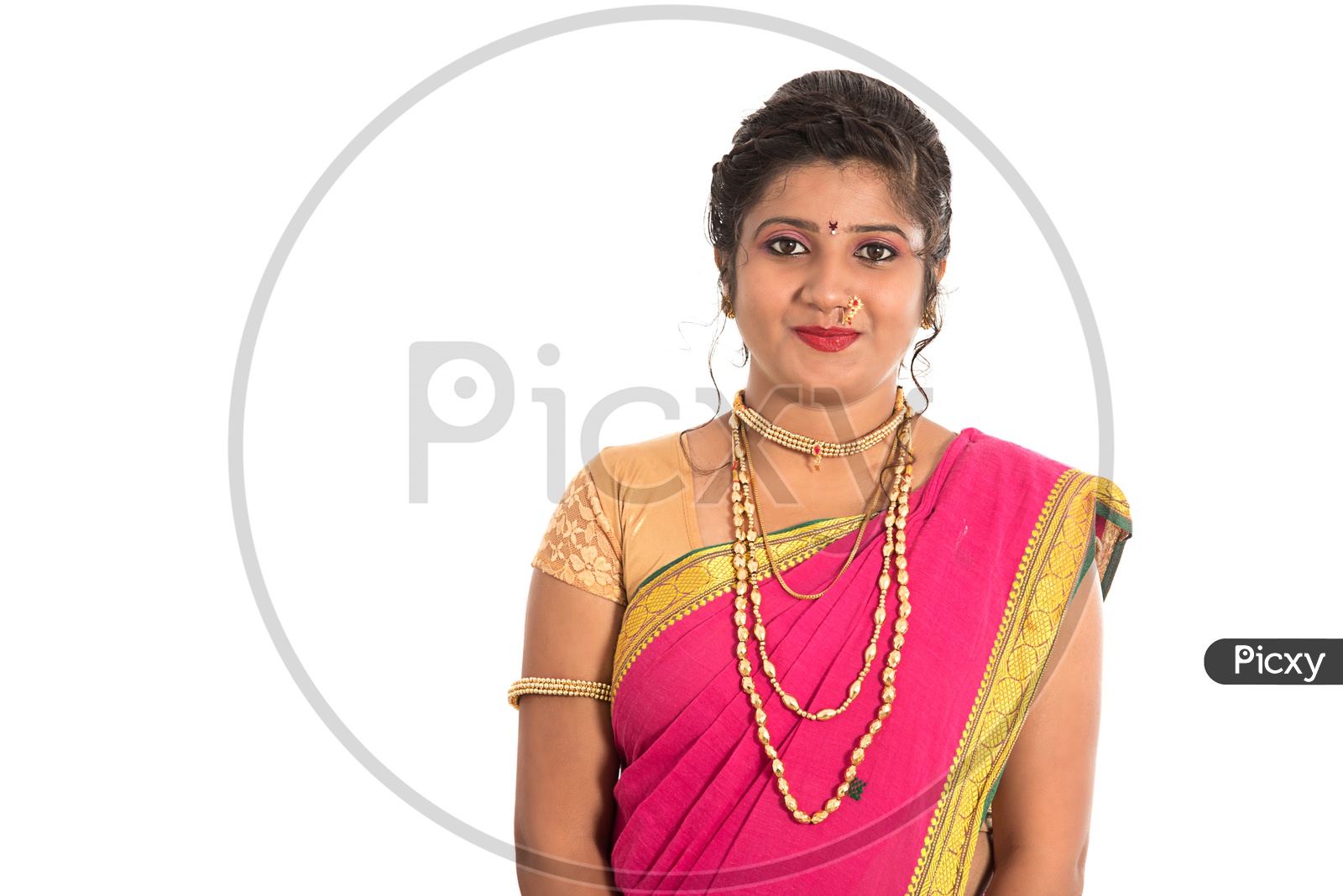 Portrait Of a Young Traditional Marathi Woman Wearing an Elegant Sari And Posing On an Isolated White Background