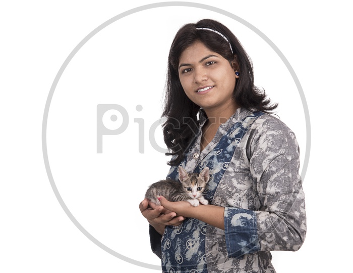 Portrait of a Pretty Young Woman  With Smile Face Holding a Cat in Hand  and Posing Over am Isolated White Background