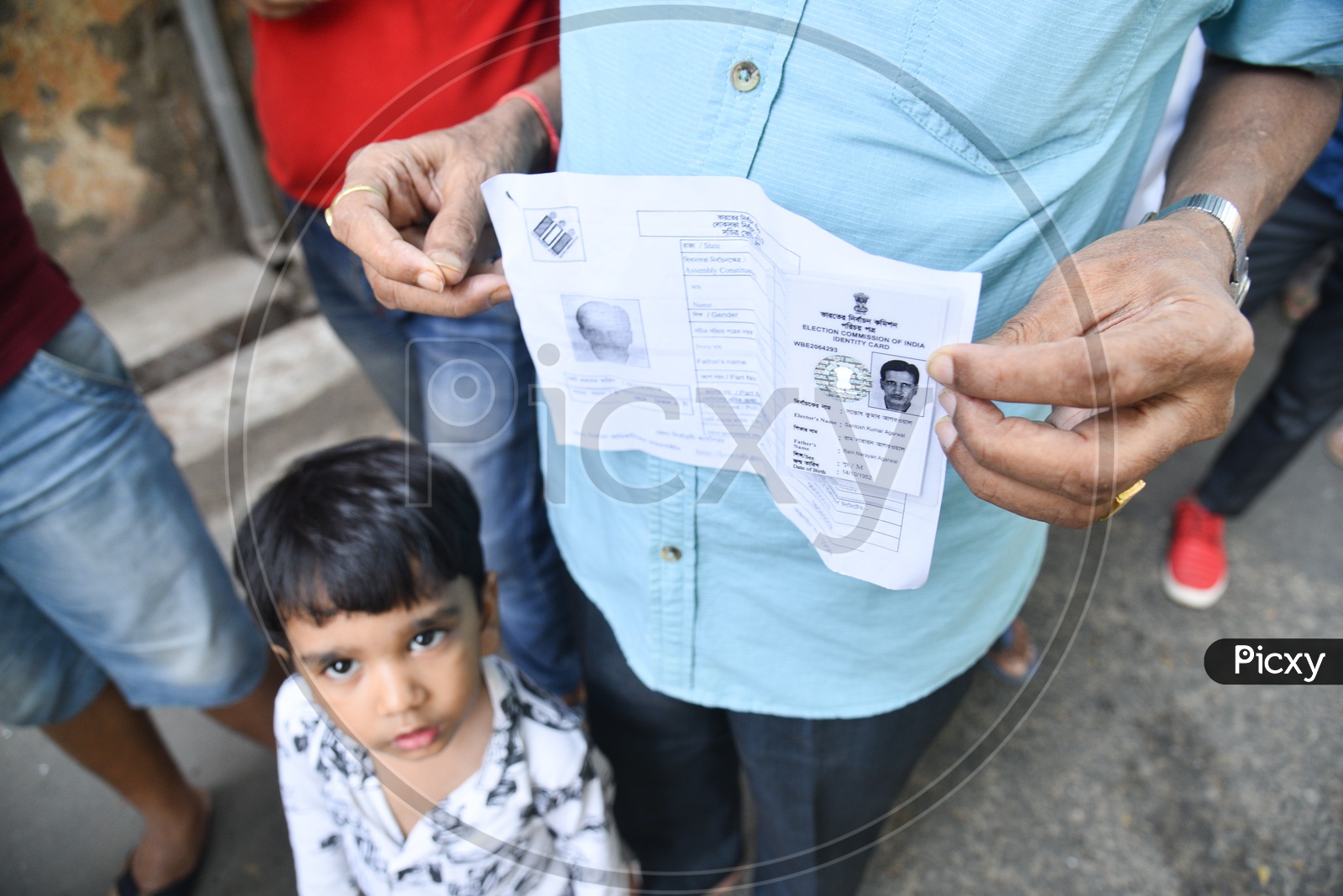 Indian Voters Showing The Voter Slips Or Id Cards At Polling Both In West Bengal During The Lok Sabha General elections 2019