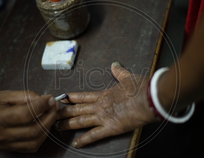 Election Booth Officers Inking The Voters Fingers At Polling Stations