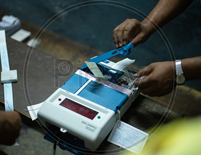 Image of Election Commission Polling Booth Officer Sealing The EVM
