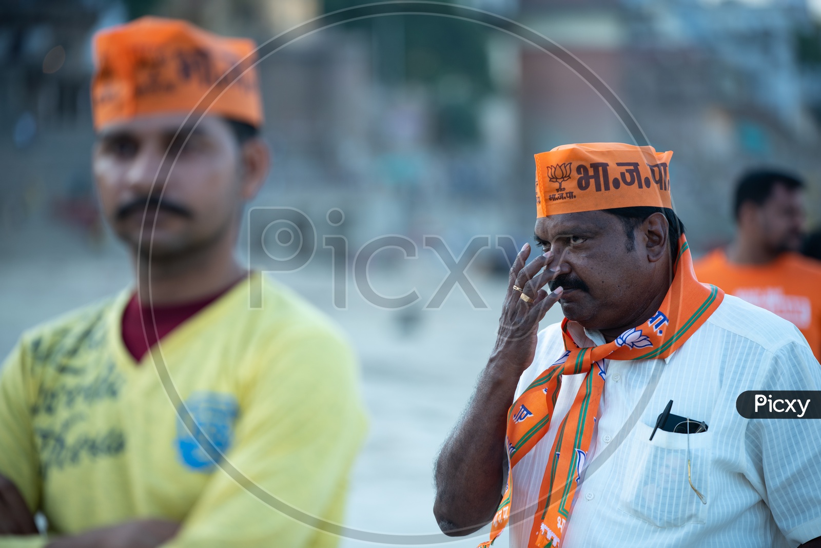 BJP Party Workers Or Supporters Wearing Party Caps And Towels In Election Campaigns