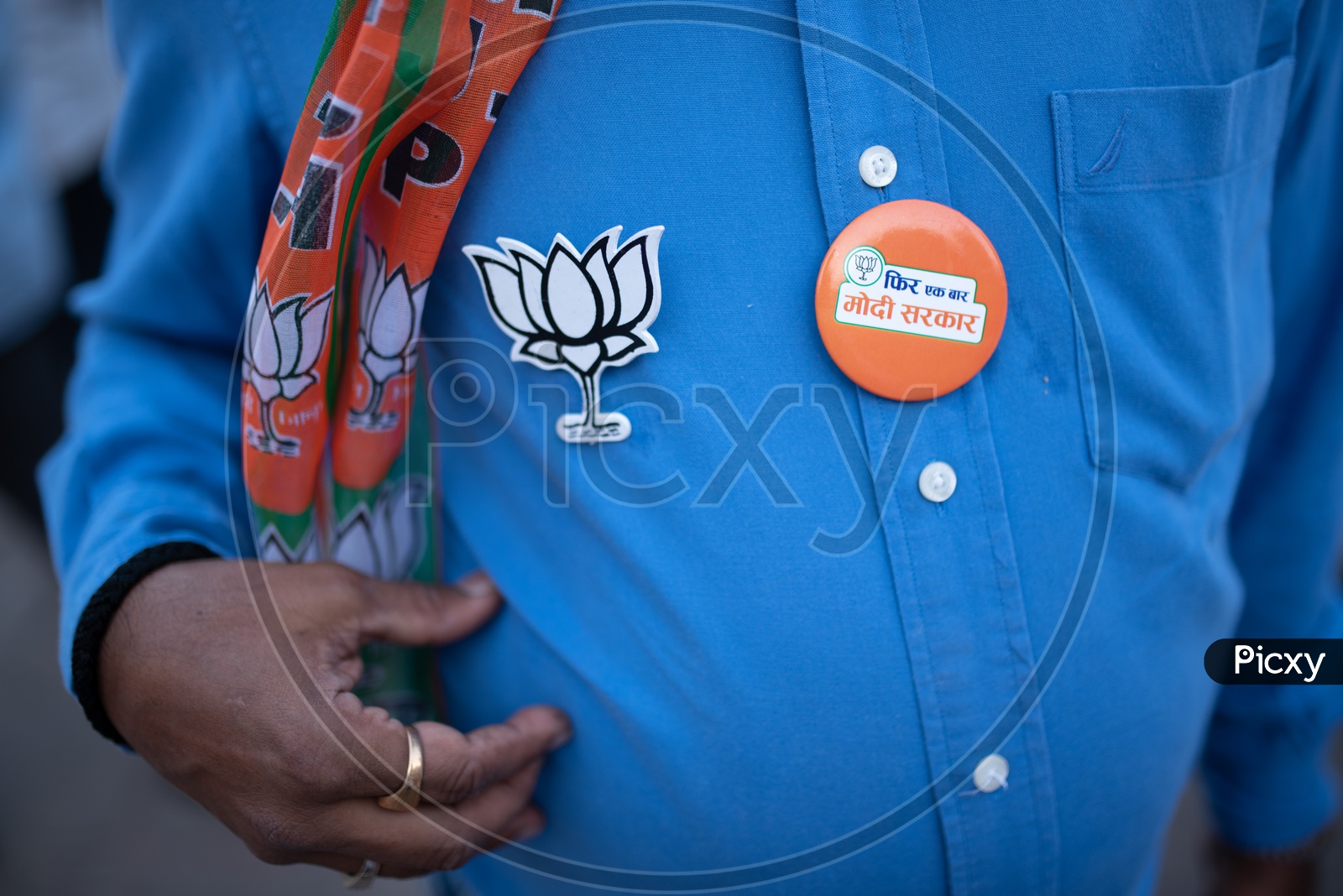 Modi Supporters Wearing BJP Party Flags And Lotus Symbol Badges During The Election Campaign For Lak Sabha General Elections 2019