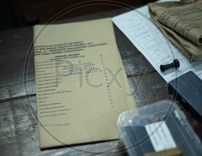 Ballot Paper Details Packets on a Table In a Polling Booth