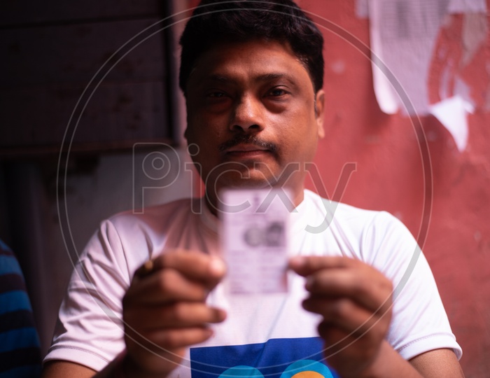 Indian Voters Showing The Voter Id Cards on Election Poling Day At Polling Booths