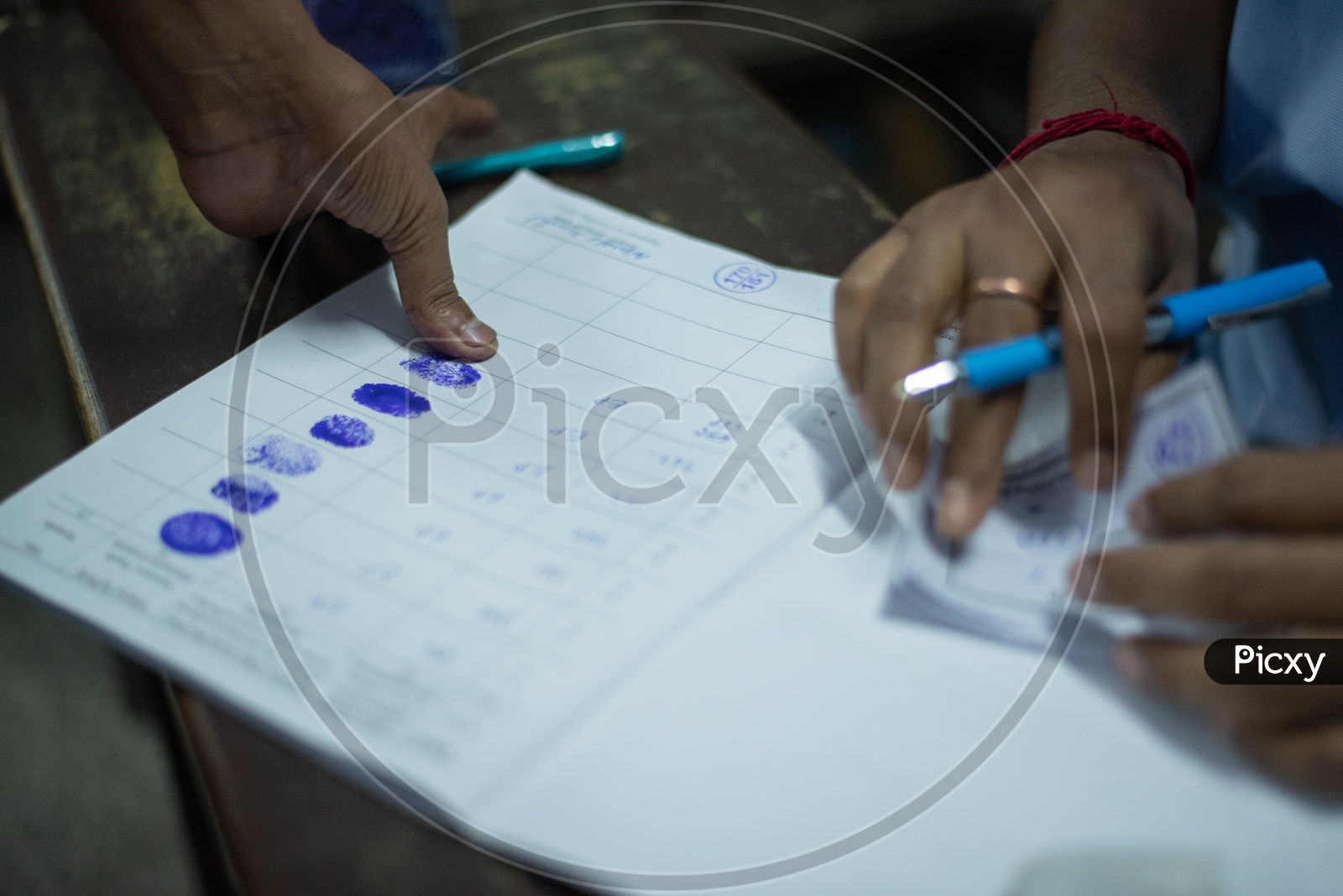 illiterate Voters Giving their Finger Prints at Polling stations