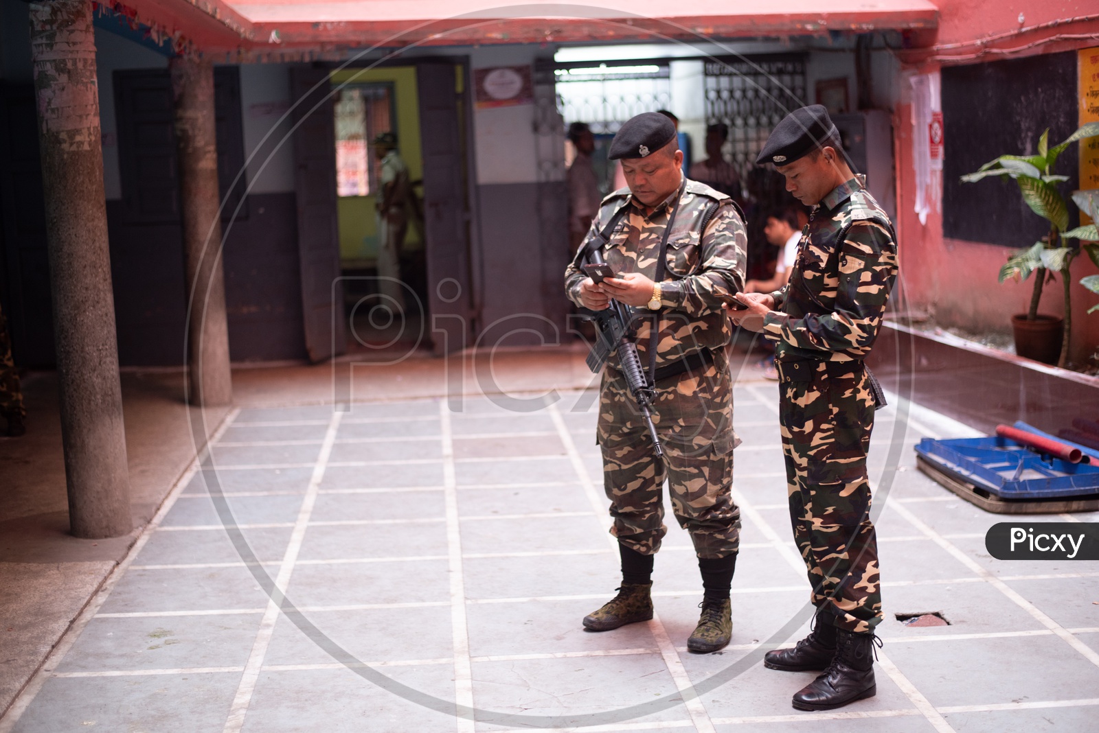 BSF Or Indian Army Security Personals using mobile phones At Polling Stations  in West Bengal Elections For Lok Sabha  General Elections 2019