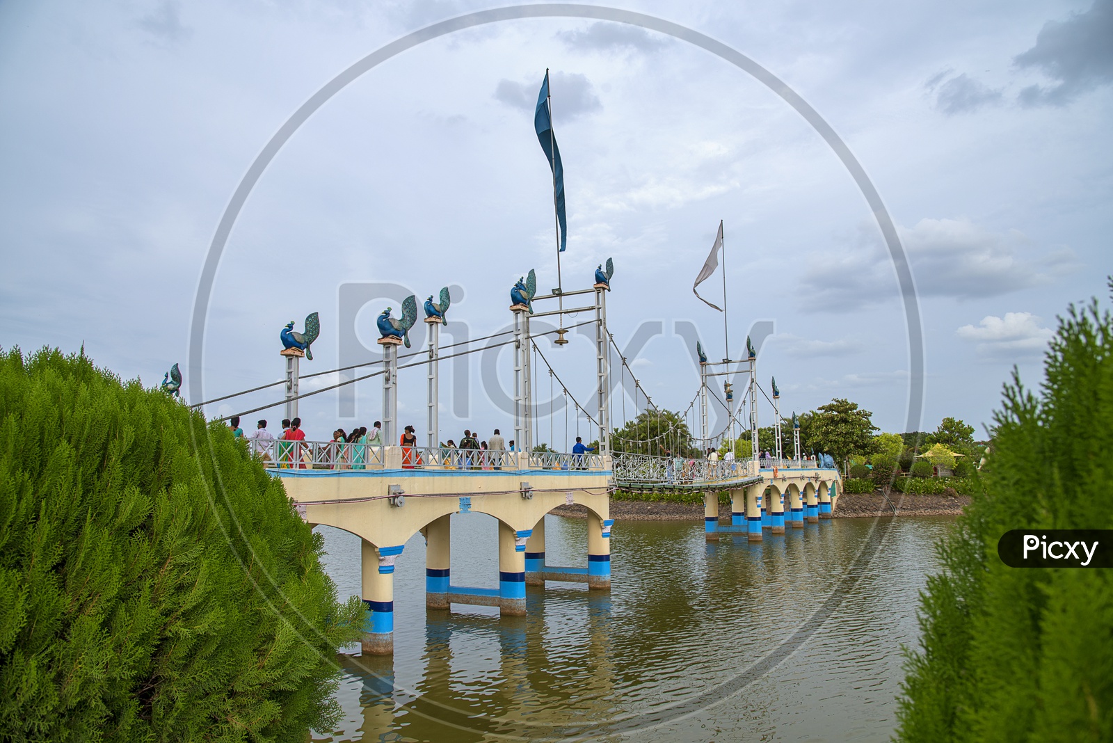 Image of Tourists Enjoying At a Bridge Over Water in Anand Sagar Temple ...