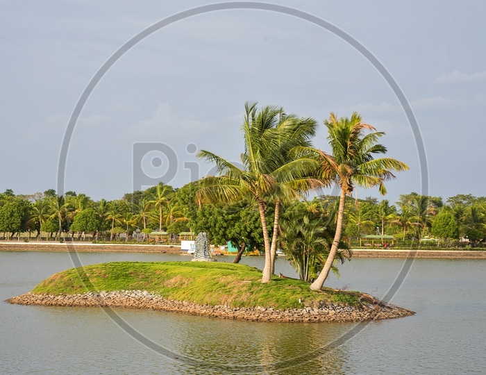 Water Front with Coconut Trees In an  Island At Anand Sagar Shri Gajanan Maharaj Sansthan  temple