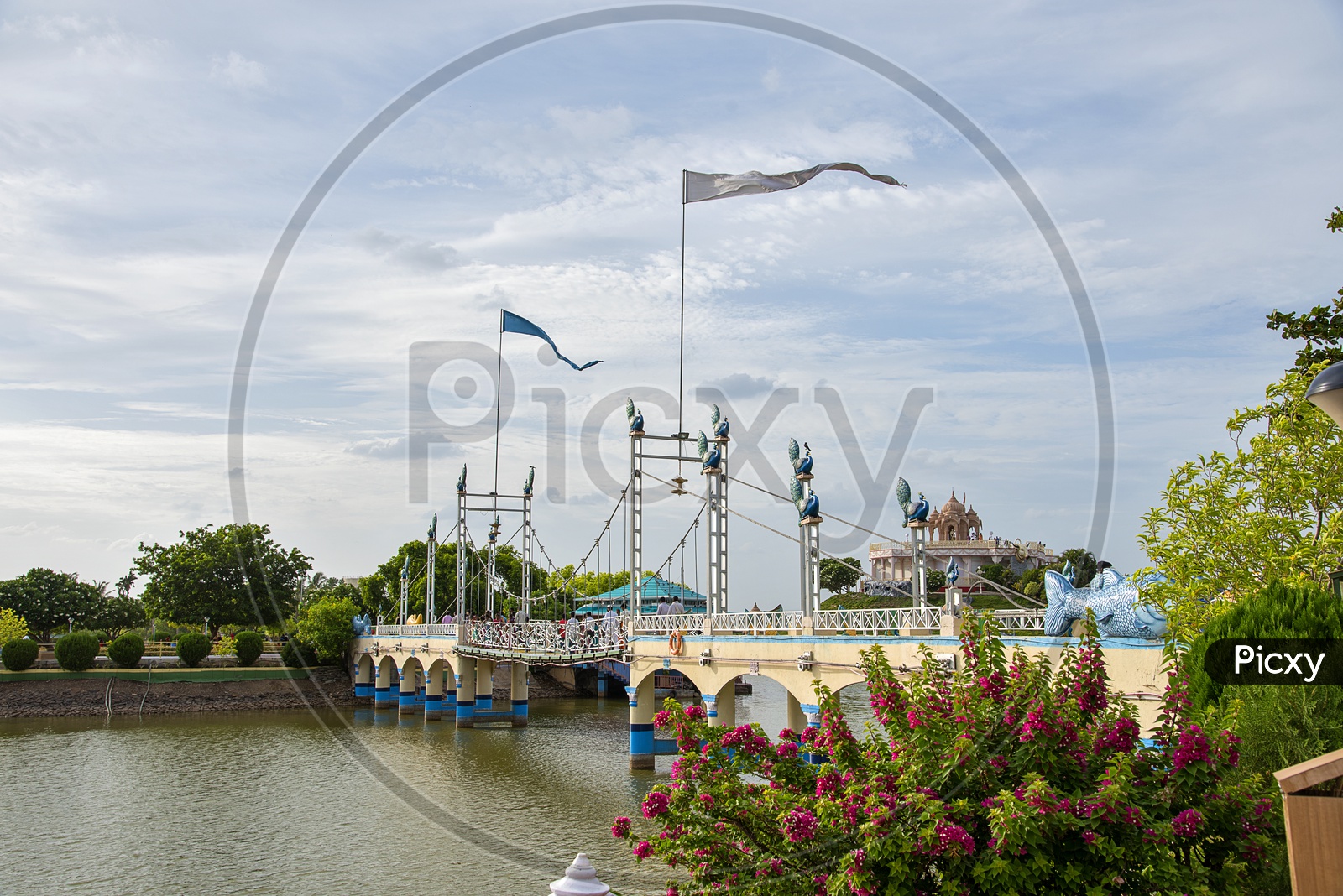 Tourists Enjoying At a Bridge Over Water in Anand Sagar Temple , Shegaon