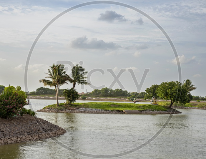 Water Front with Coconut Trees In an  Island At Anand Sagar Shri Gajanan Maharaj Sansthan  temple