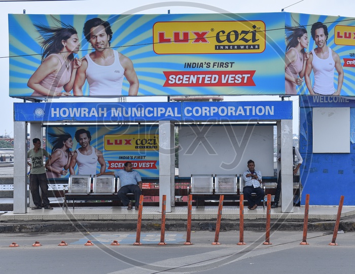 Commuters Waiting In a Bus Stop Built By Howrah Municipal Corporation