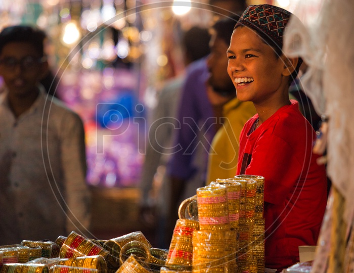 A boy selling bangles during Ramzan,Charminar