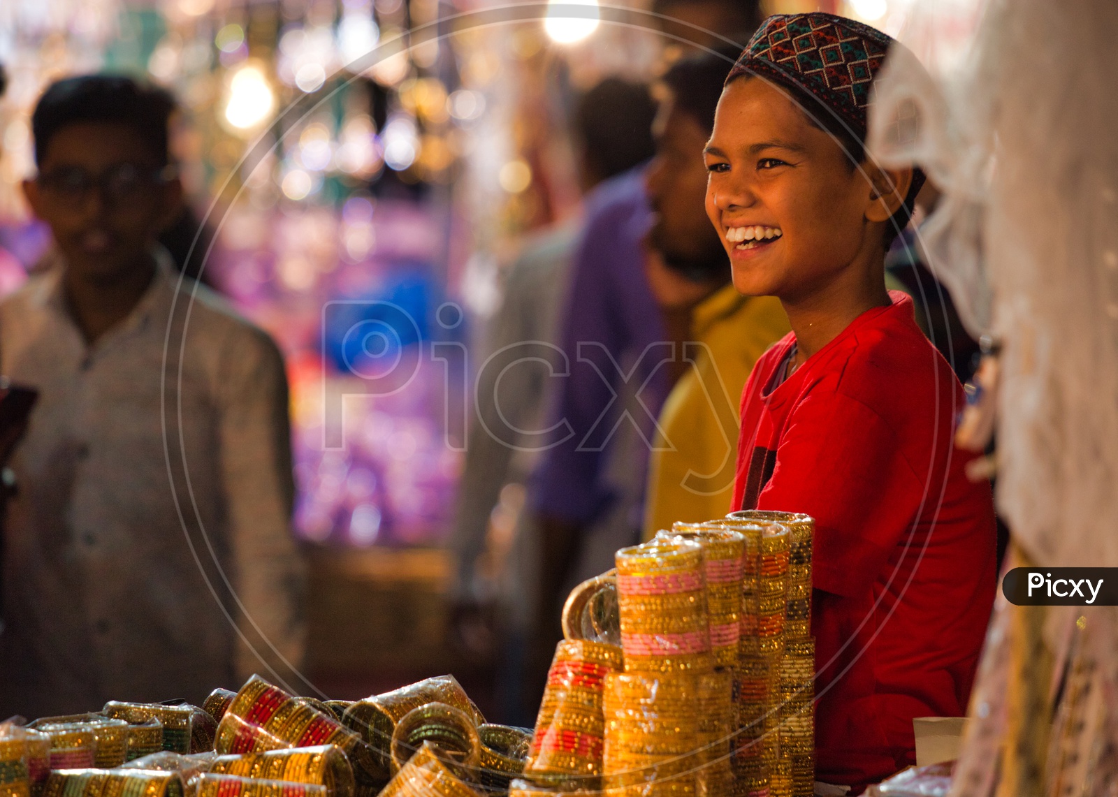 A boy selling bangles during Ramzan,Charminar