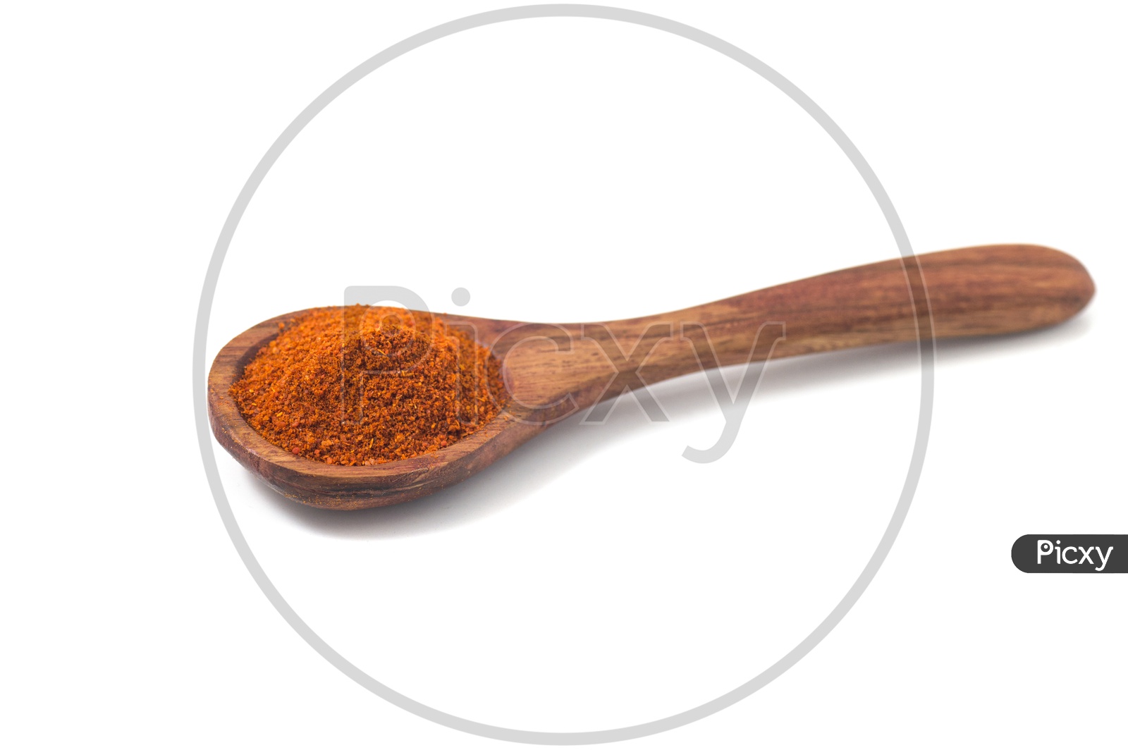 paprika powder spices on spoons isolated on a white background