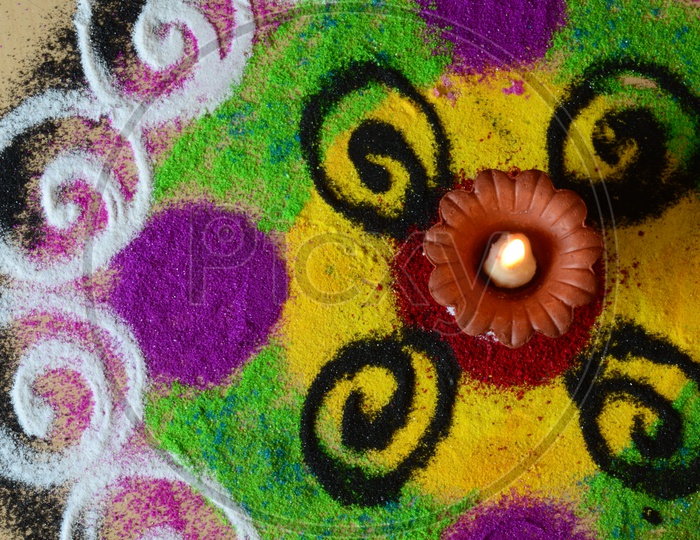 Indian Festival Diwali Clay Diyas In Colorful Rangoli