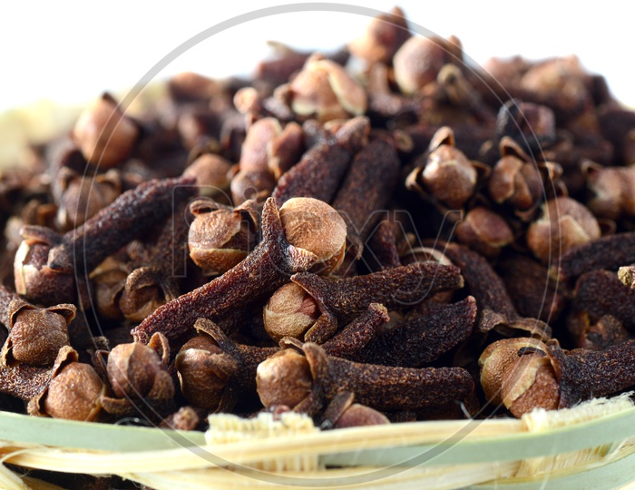 Image of Cloves Or Indian Spice Cloves in a Wooden Weaved Basket On An