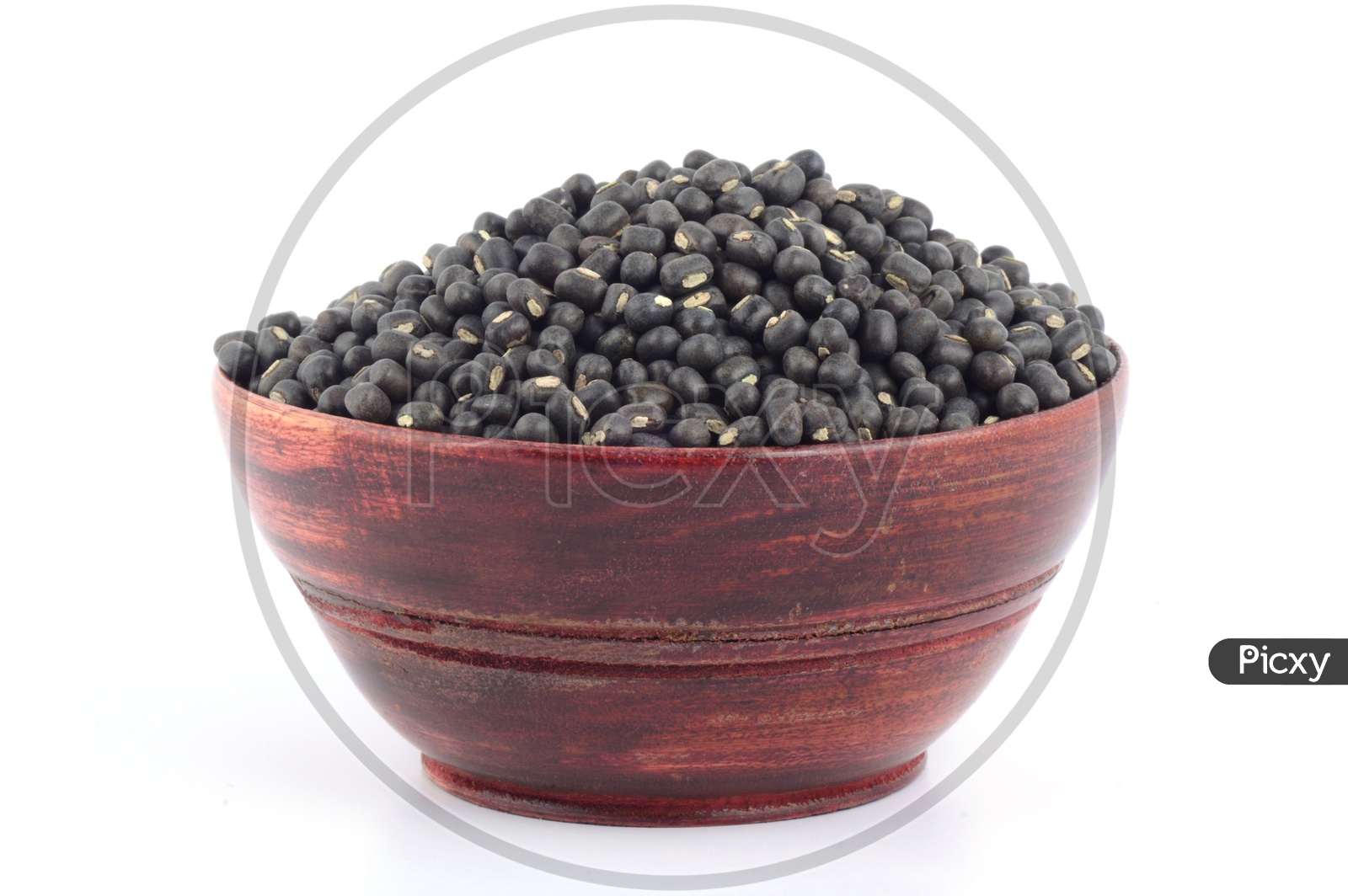 Urad dal, black gram, Vigna mungo  In wooden Bowl on  An Isolated white background