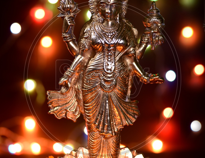 Indian Hindu Goddess Lakshmi Idols During Diwali Festival Worships and Celebrations on a Led Light Bokeh  Background