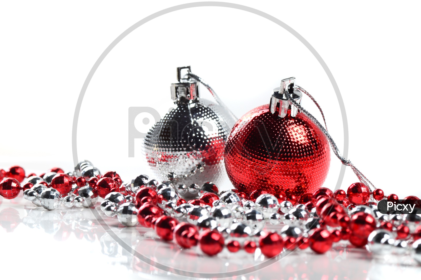 Christmas Tree Decoration Balls, Ornaments  And Chains on an Isolated White Background