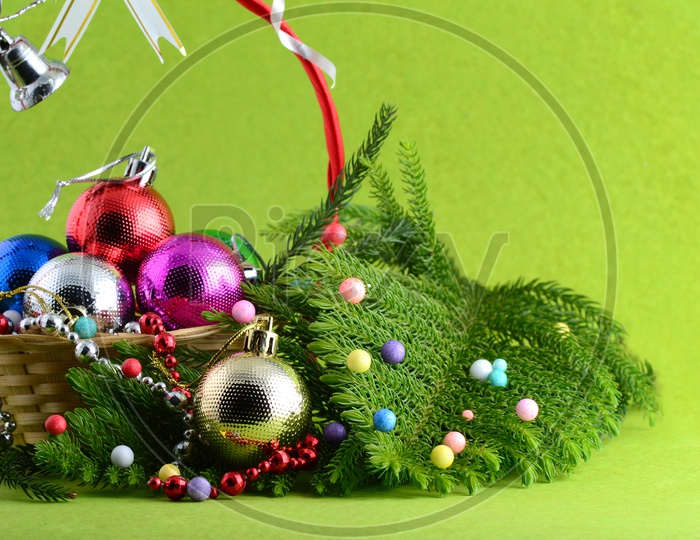 Christmas Decoration Balls With Christmas Tree Branch Forming a Background For Christmas Wishes