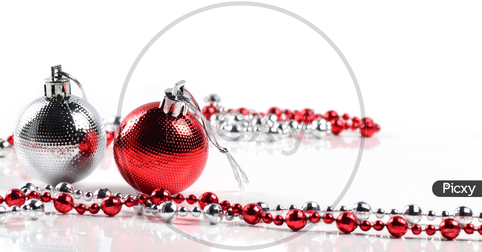Christmas balls with ornaments on white background.