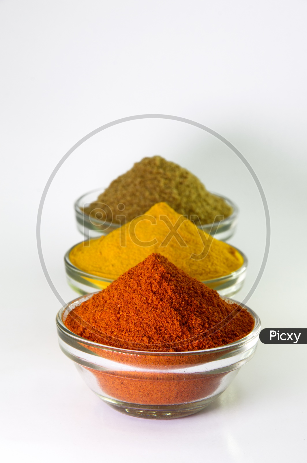 Spice Powder : Chili, Turmeric & Coriander in Bowl isolated on White background.