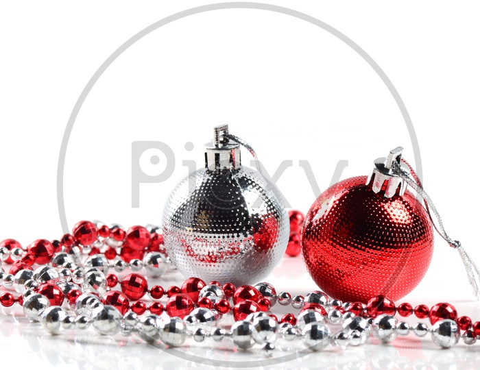 Christmas balls with ornaments on white background.