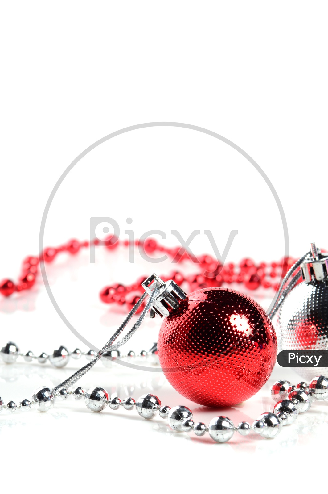 Christmas Tree Decoration Balls, Ornaments and Chains on an Isolated White Background