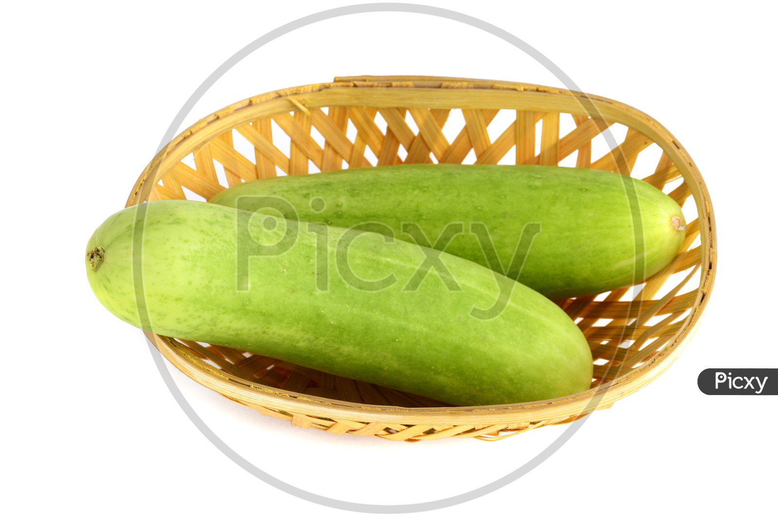 Fresh Green Cucumber Or Keera in a Wooden Weaved Basket on an Isolated White Background
