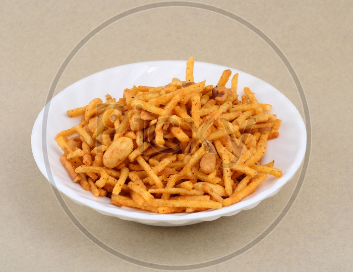 Deep fried salty dish - chivda or mixture made of gram flour and mixed with dry fruits.