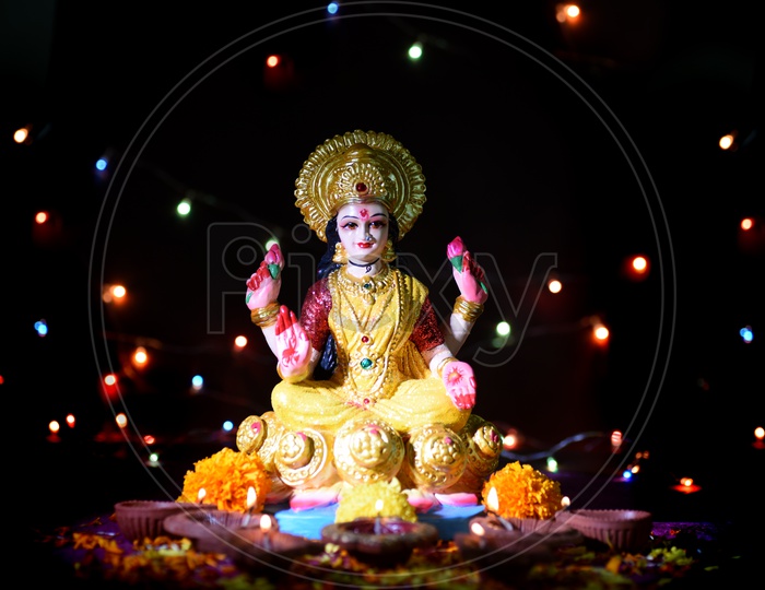 Indian Hindu Goddess Lakshmi Idols During Diwali Festival Worships and Celebrations on a Led Light Bokeh  Background