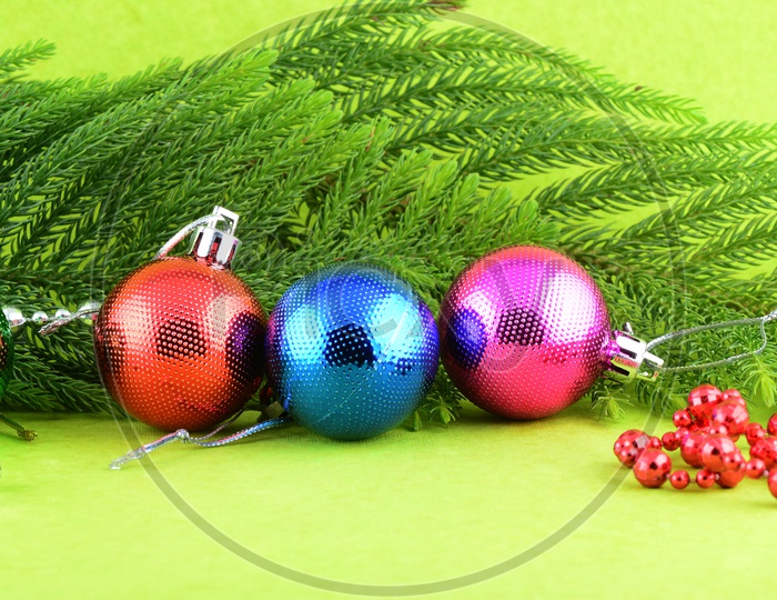 Christmas Decorative Color Balls And Christmas Tree Branch and Ornaments Filled Background For Christmas Wishes