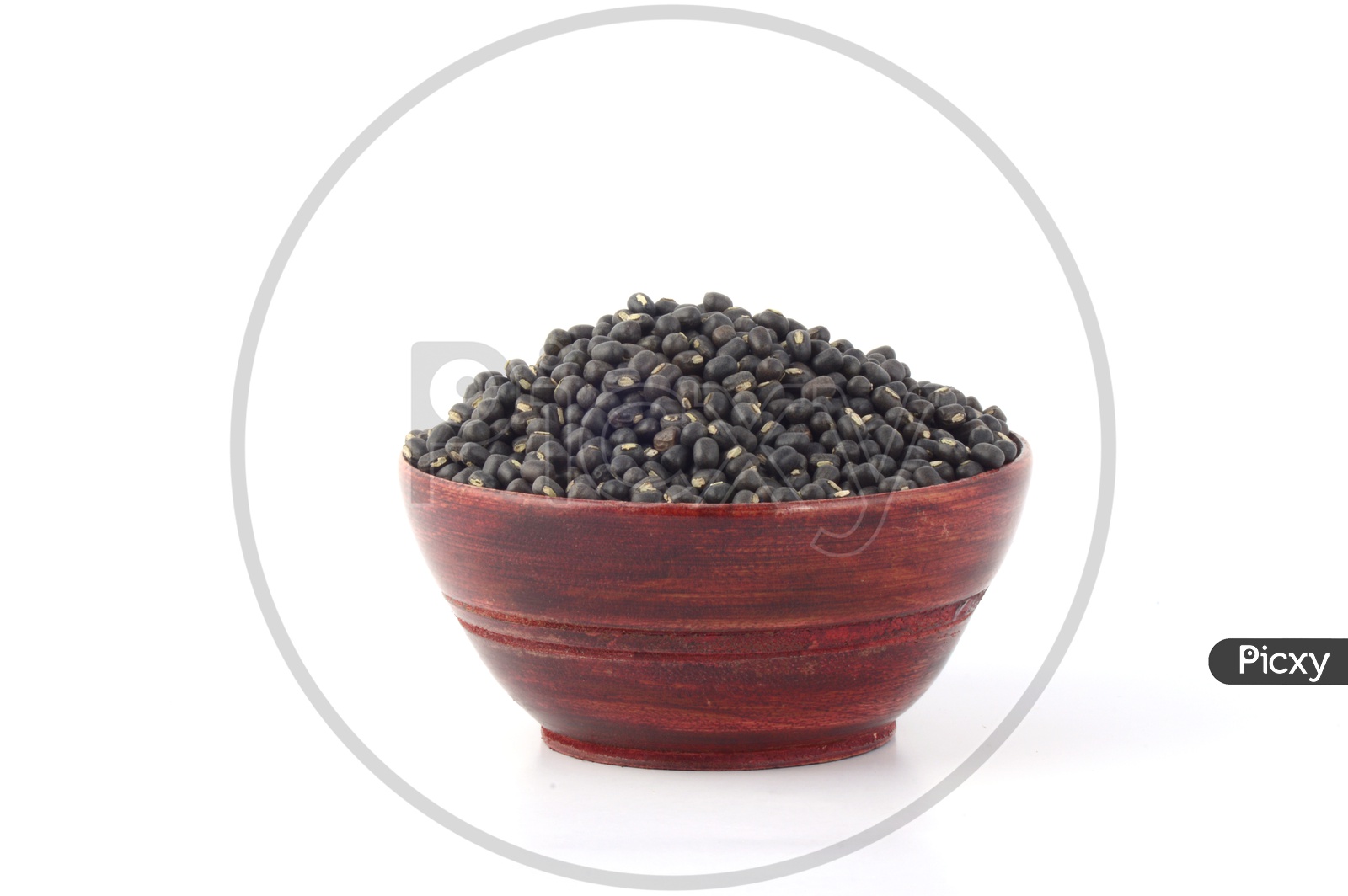 Urad dal, black gram, Vigna mungo in a Wooden  Pot on An Isolated  white background