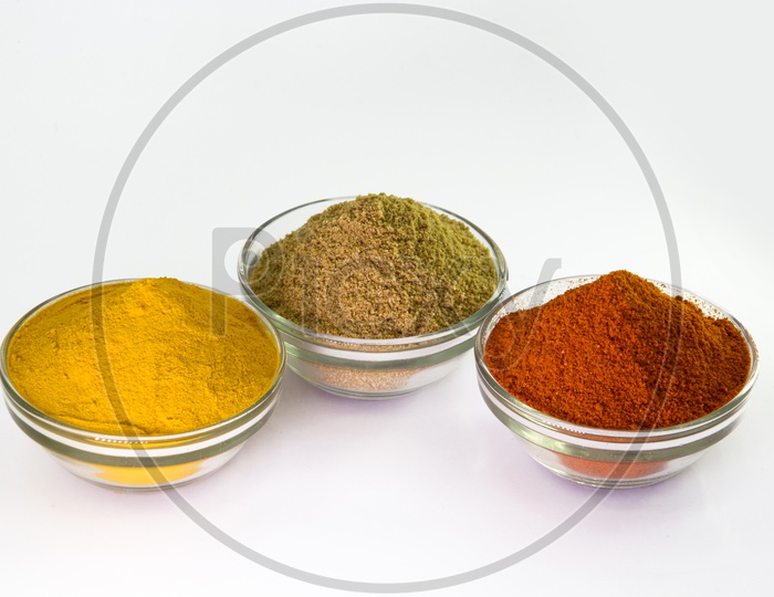 Spice Powder : Chili, Turmeric & Coriander in Bowl isolated on White background.