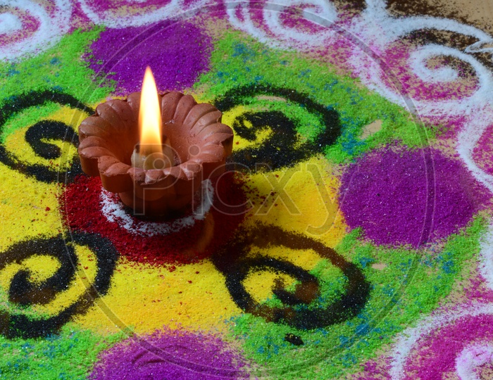 Indian Festival Diwali Clay Diyas In Colorful Rangoli For Diwali Greetings or Wishes Templates