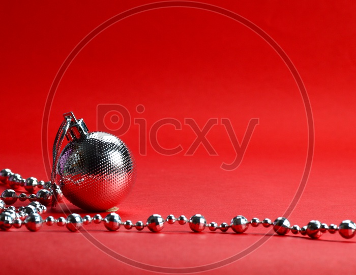 Christmas balls with ornaments On an Isolated Red Background
