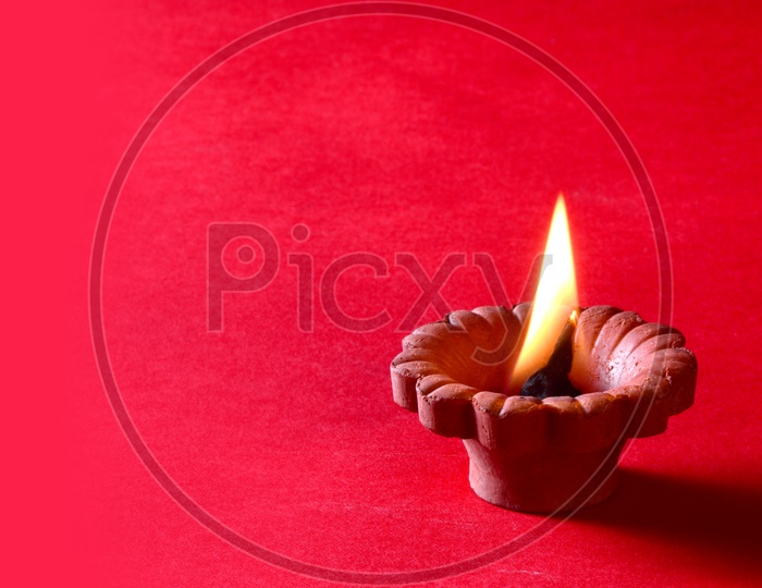 Indian Festival Diwali Clay Diyas on An Isolated Background For Diwali Greetings or Wishes Templates