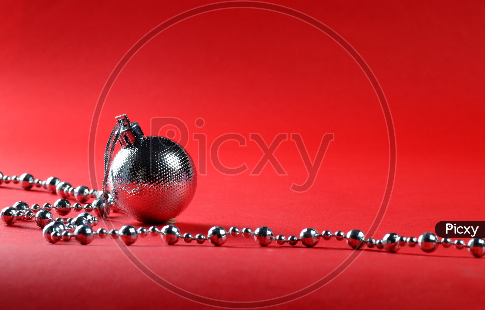 Christmas balls with ornaments On an Isolated Red Background