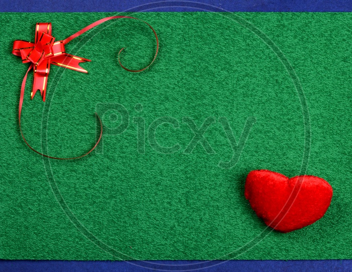 A Template With Spacing And  Heart Symbol And Gift Ribbon
